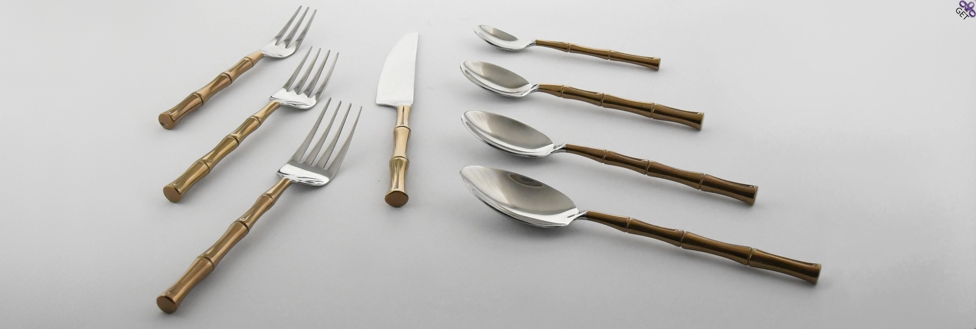 Hand-forged Royal Bamboo flatware collection mirror polished stainless steel bamboo shaped titanium nitride coated handles.